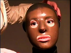 Slave Girl Wrapped In Skintight Latex